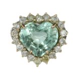 AN AQUAMARINE AND DIAMOND CLUSTER RING in 18ct white gold set with a large, heart shaped modified