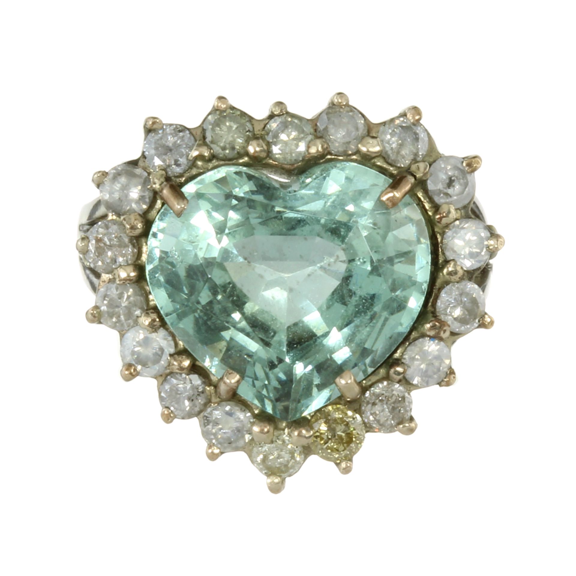 AN AQUAMARINE AND DIAMOND CLUSTER RING in 18ct white gold set with a large, heart shaped modified