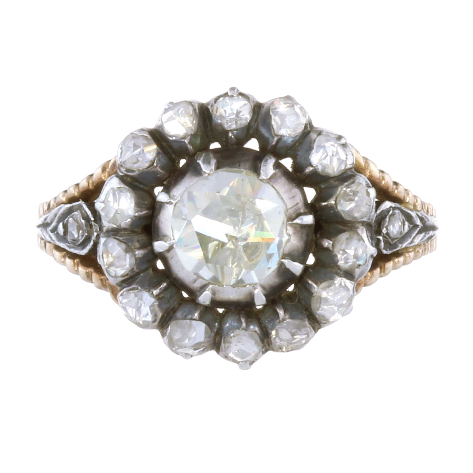 AN ANTIQUE DIAMOND CLUSTER DRESS RING in high carat yellow gold and silver set with a central rose