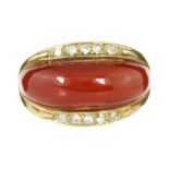 A CARNELIAN AND DIAMOND DRESS RING in 14ct yellow gold set with a polished bevelled carnelian