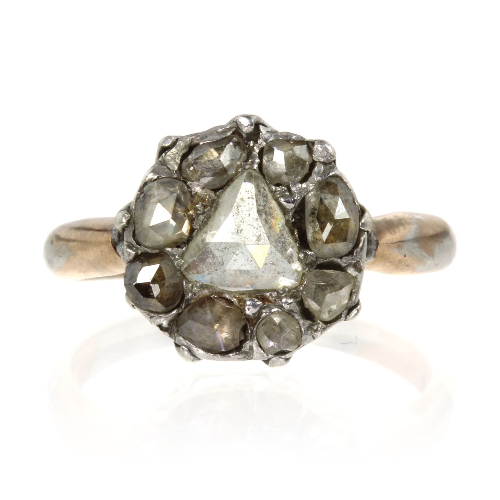 A DIAMOND CLUSTER RING, PROBABLY FRENCH set with a central triangular rose cut diamond within a