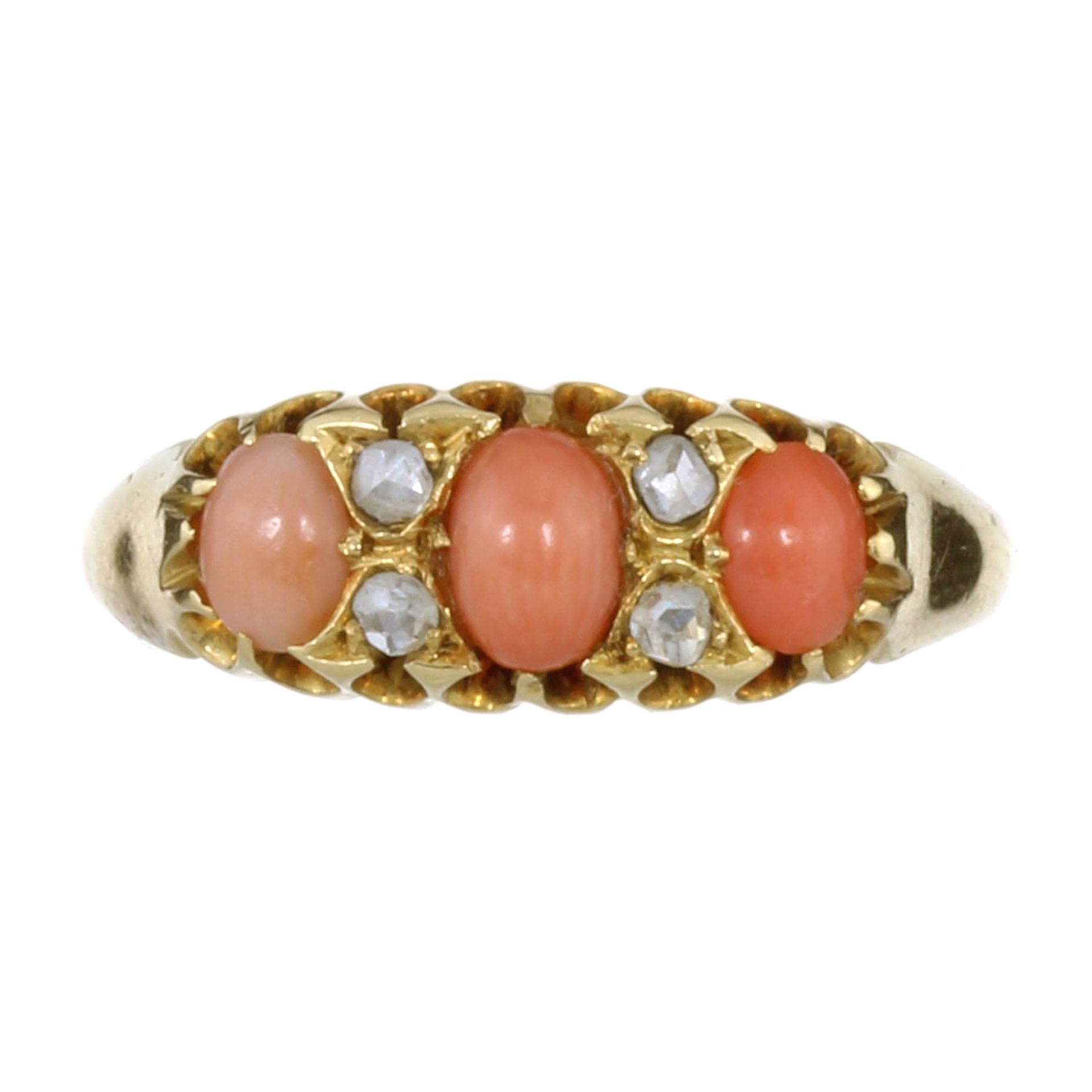 AN ANTIQUE VICTORIAN CORAL AND DIAMOND RING, 1898 in 18ct yellow gold, set with three graduated oval