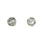 A PAIR OF ROSE CUT DIAMOND STUD EARRINGS in yellow gold and silver, each set with a rose cut diamond