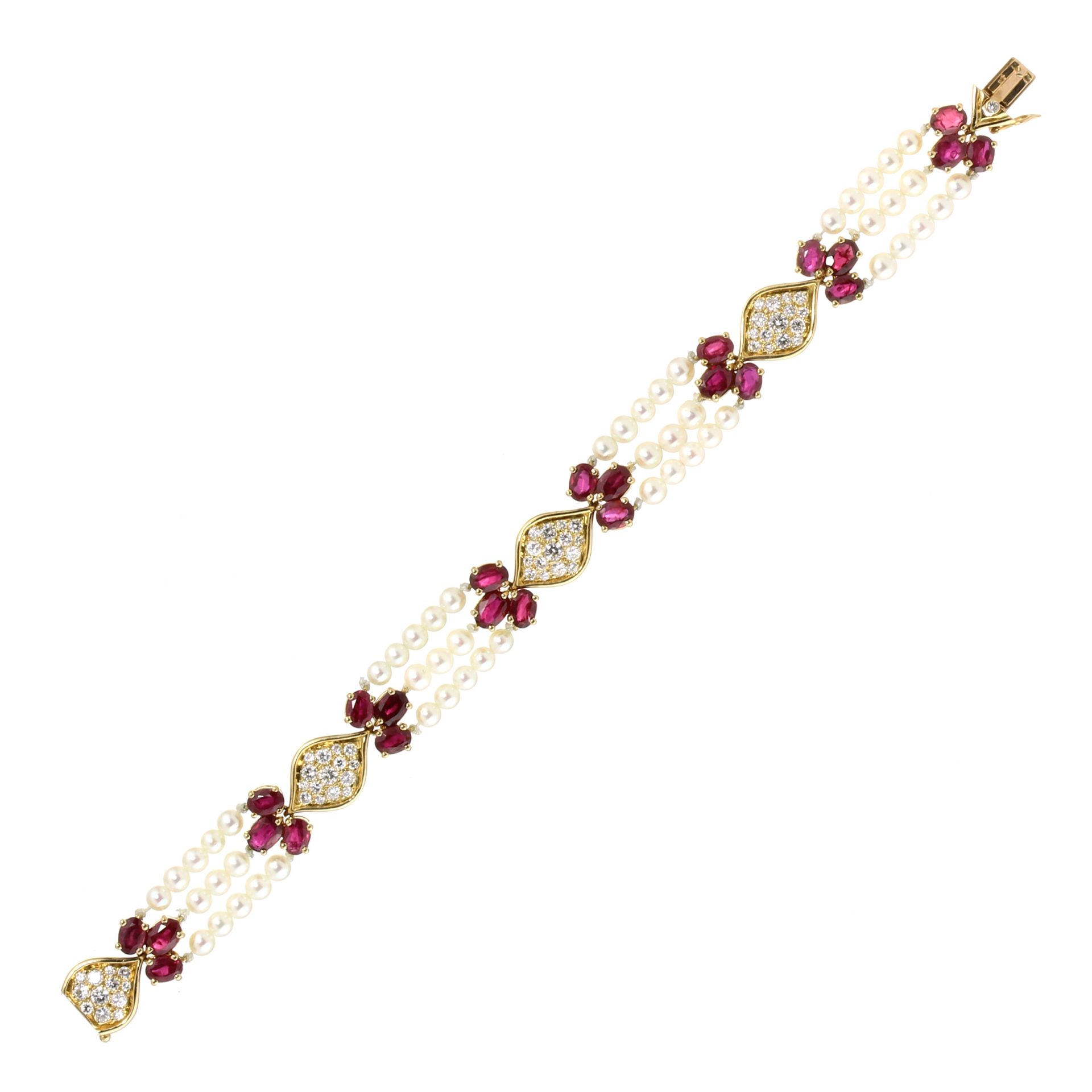 A RUBY, DIAMOND AND PEARL BRACELET, VAN CLEEF & ARPELS designed as three strands of pearls