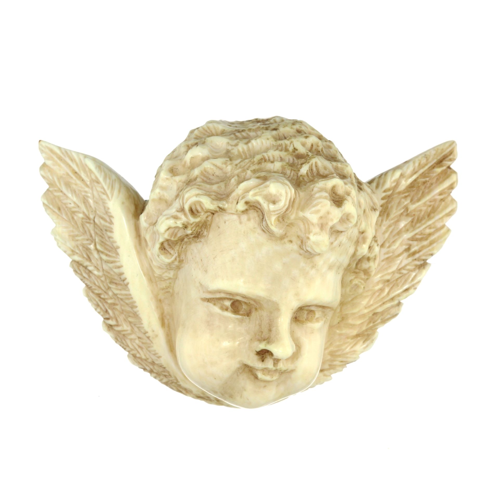 AN ANTIQUE CARVED IVORY CHERUB BROOCH, LATE 19TH CENTURY carved in detail to depict the head of a