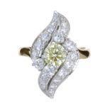 A YELLOW AND WHITE DIAMOND DRESS RING in 18ct yellow gold, set with a central round cut yellow