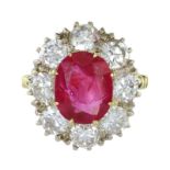 A 4.44 CARAT BURMA NO HEAT RUBY AND DIAMOND RING in yellow gold set with an oval cut ruby of 4.44