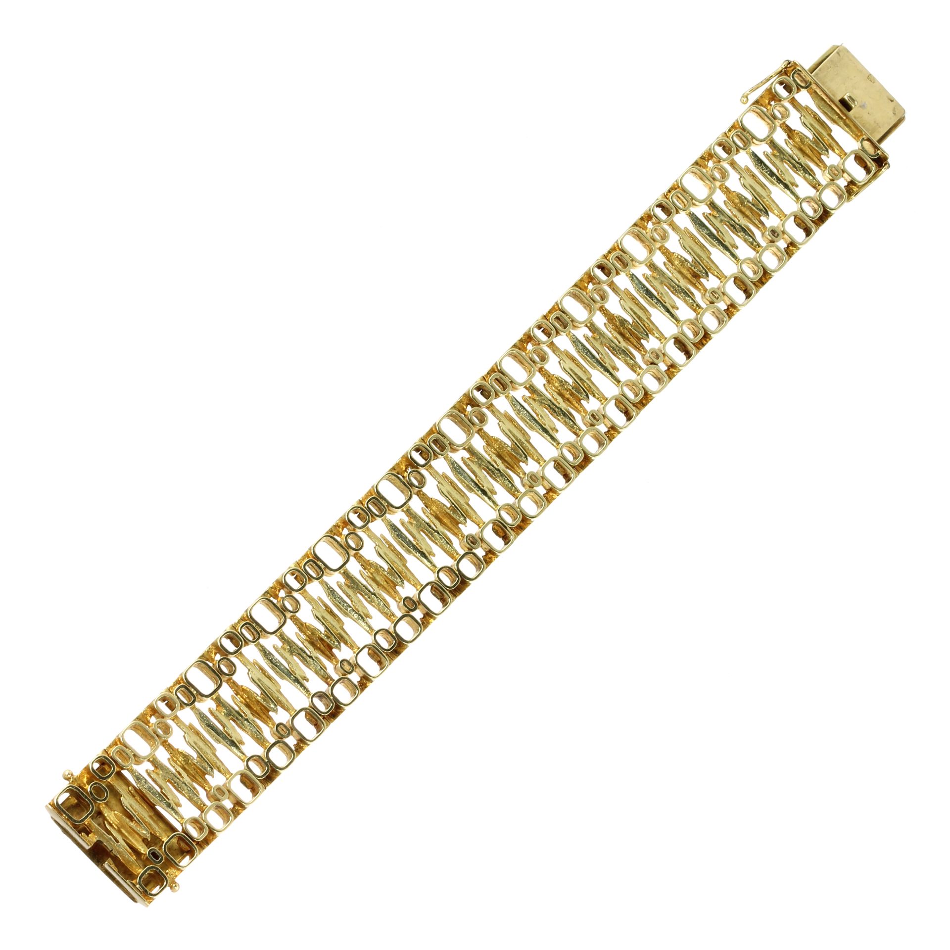 A FANCY LINK GOLD BRACELET, CIRCA 1970 in high carat yellow gold comprising links of various