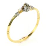 AN ANTIQUE DIAMOND, SAPPHIRE AND RUBY DOG BANGLE in high carat yellow gold set with a jewelled