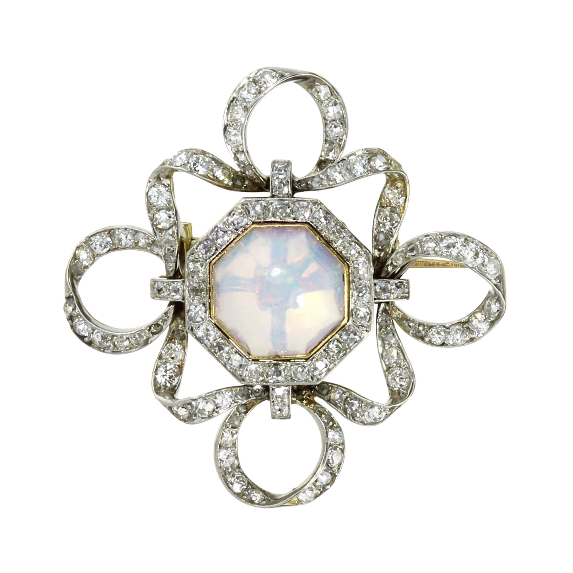 AN ANTIQUE OPAL AND DIAMOND BROOCH / PENDANT in 18ct yellow gold and platinum set with an