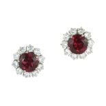 A PAIR OF RUBELLITE TOURMALINE AND DIAMOND CLUSTER STUD EARRINGS in platinum each set with a round