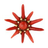 AN CORAL PENDANT in 18ct yellow gold, set with a central polished coral bead of 12mm surrounded by a