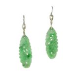 AN PAIR OF CARVED JADE EARRINGS in white gold and silver, each set with an elongated carved piece of