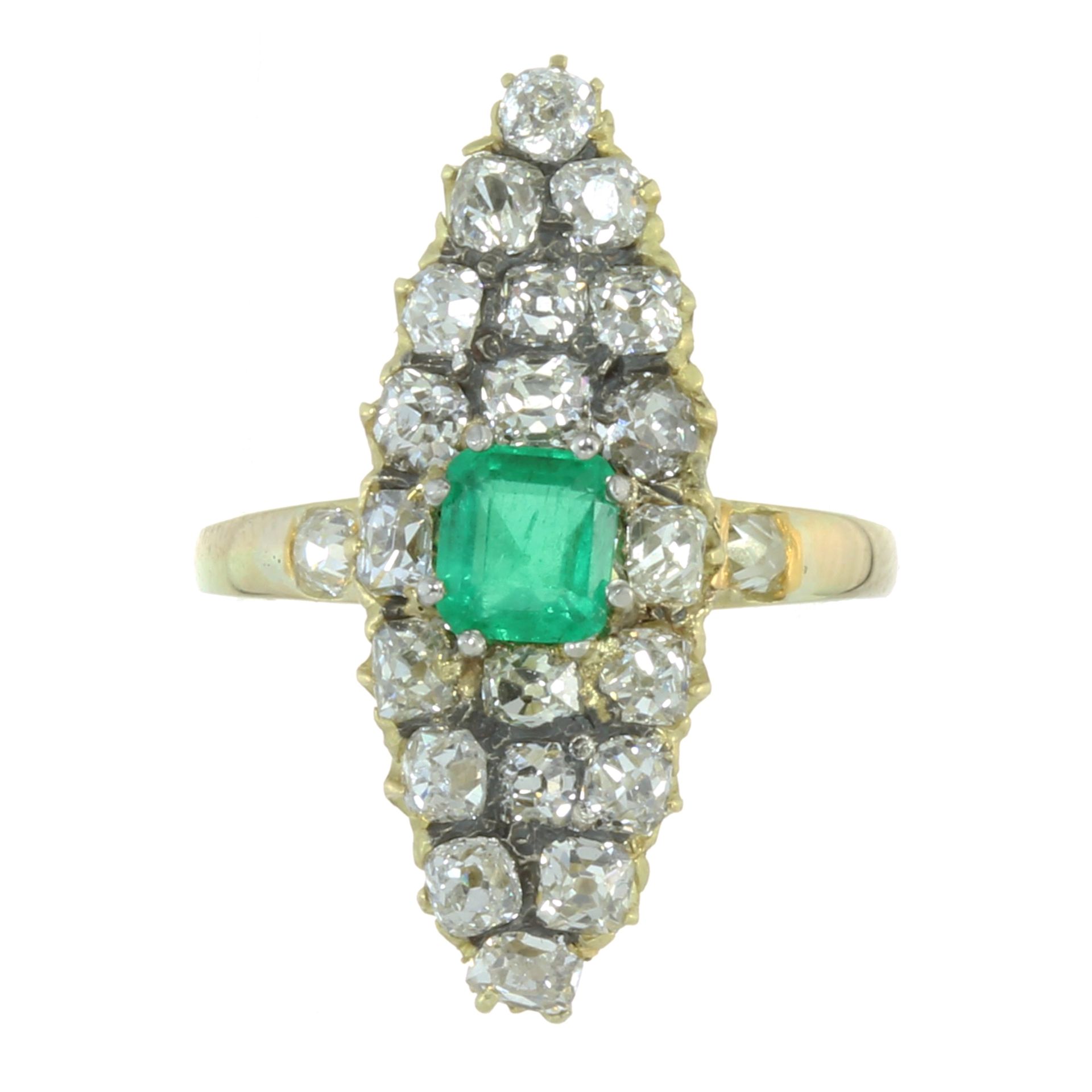 AN ANTIQUE EMERALD AND DIAMOND DRESS RING in high carat yellow gold, set with a central step cut
