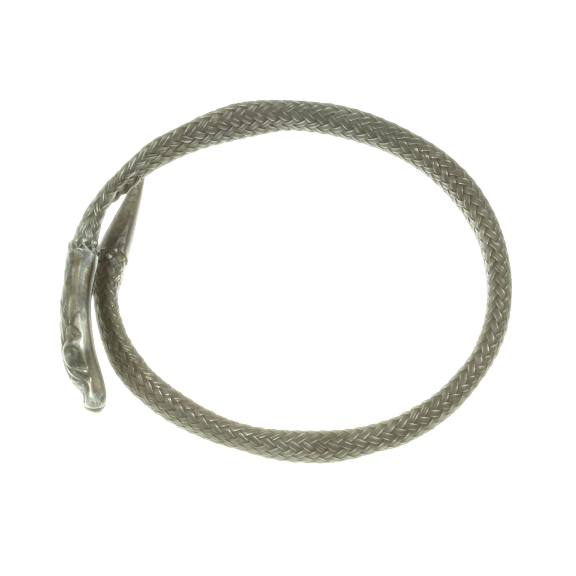 AN ANTIQUE SNAKE BRACELET / BANGLE in silver, designed as the body of a serpent coiled around