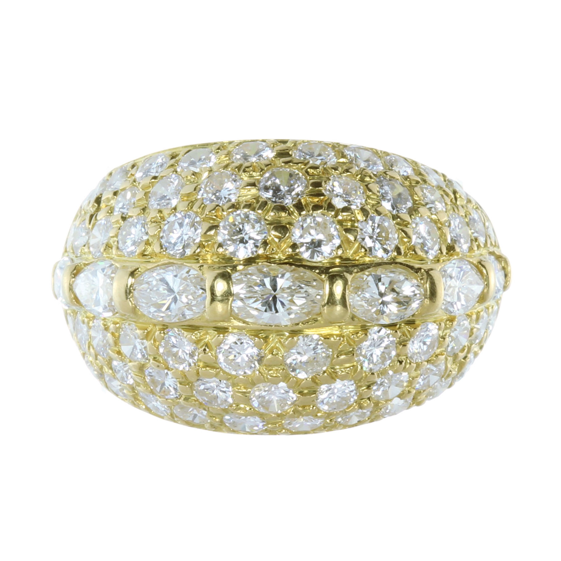 A DIAMOND BOMBE DRESS RING in high carat yellow gold, set with a central row of seven oval cut