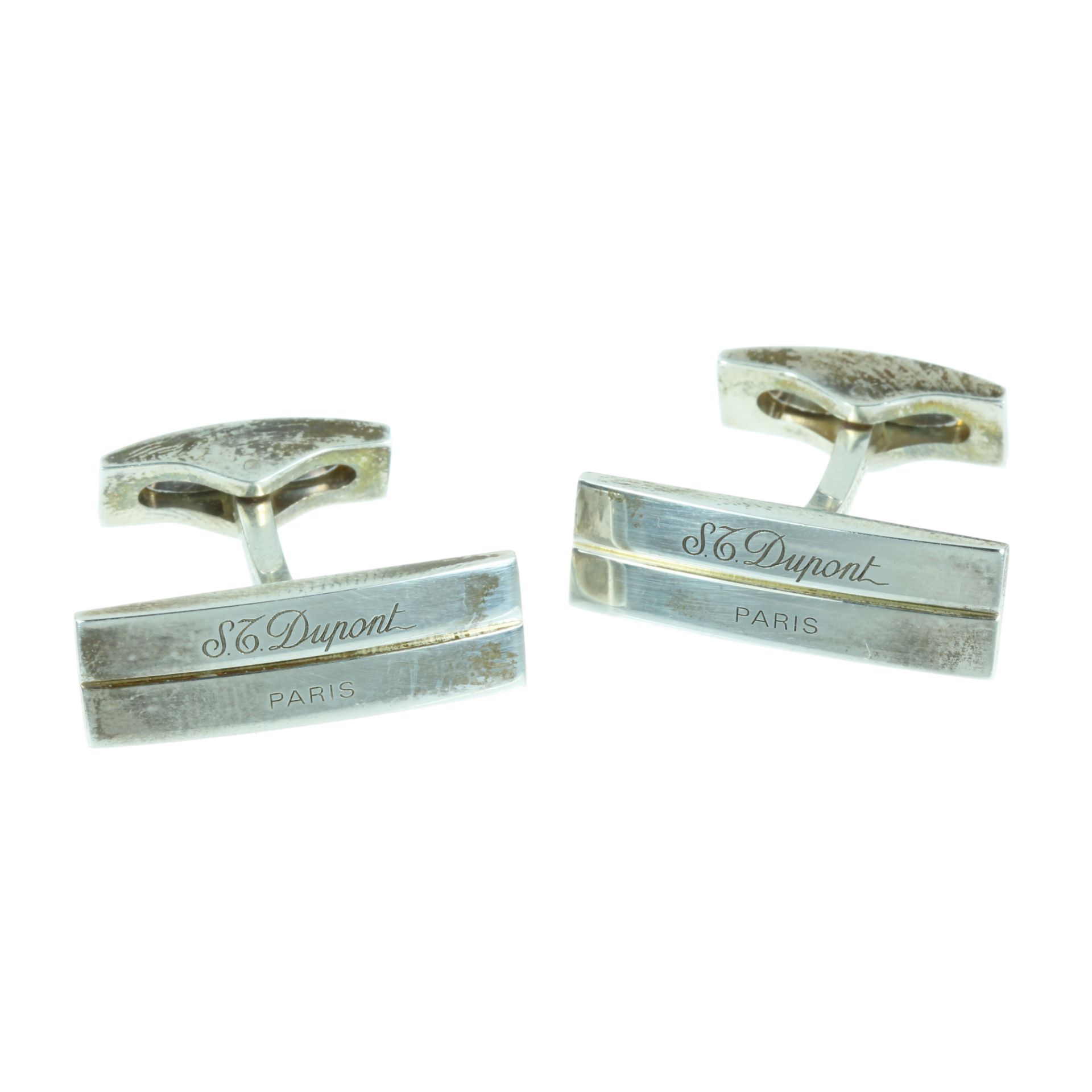 A PAIR OF CUFFLINKS BY DUPONT in sterling silver, each with an elongated rectangular face, signed