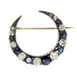 AN ANTIQUE BLUE SAPPHIRE AND DIAMOND CRESCENT BROOCH in 18ct yellow gold and silver, designed as a