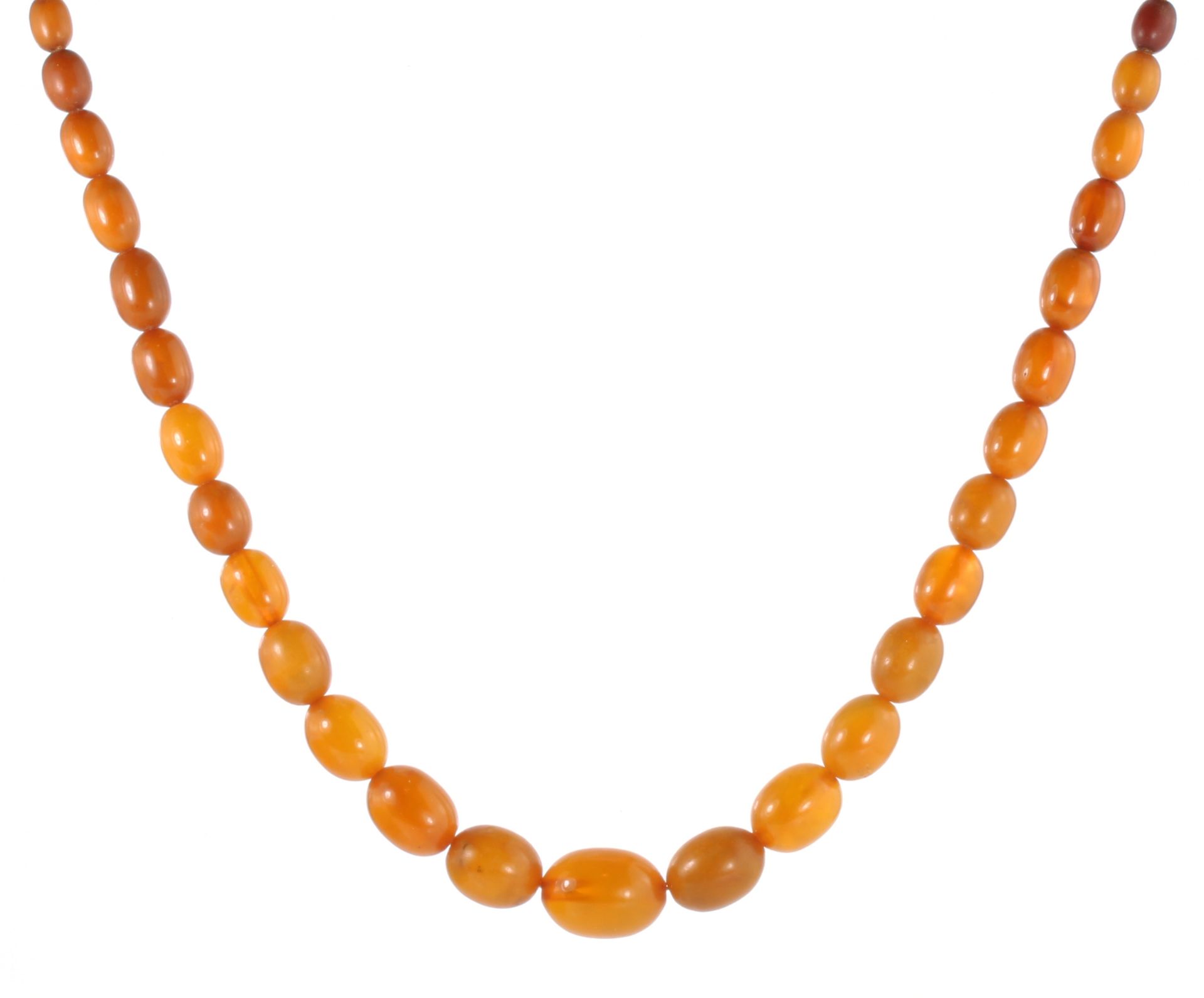 AN ANTIQUE NATURAL AMBER BEAD NECKLACE comprising a single row of seventy-three graduated polished