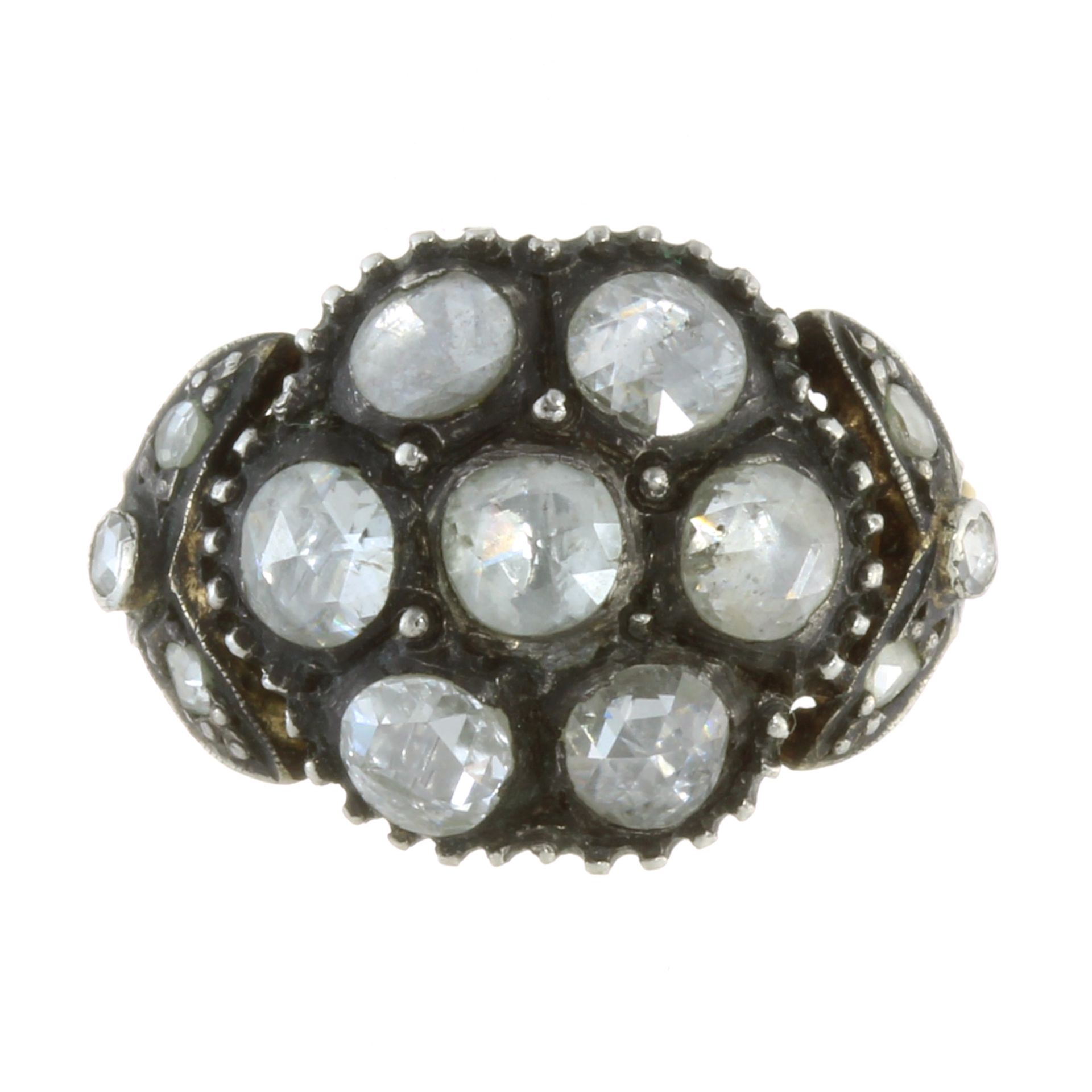 AN ANTIQUE DIAMOND CLUSTER RING, DUTCH 19TH CENTURY in high carat yellow gold and silver set with