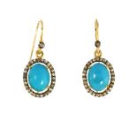 A PAIR OF TURQUOISE AND DIAMOND CLUSTER EARRINGS in gold and silver, each set with a central oval