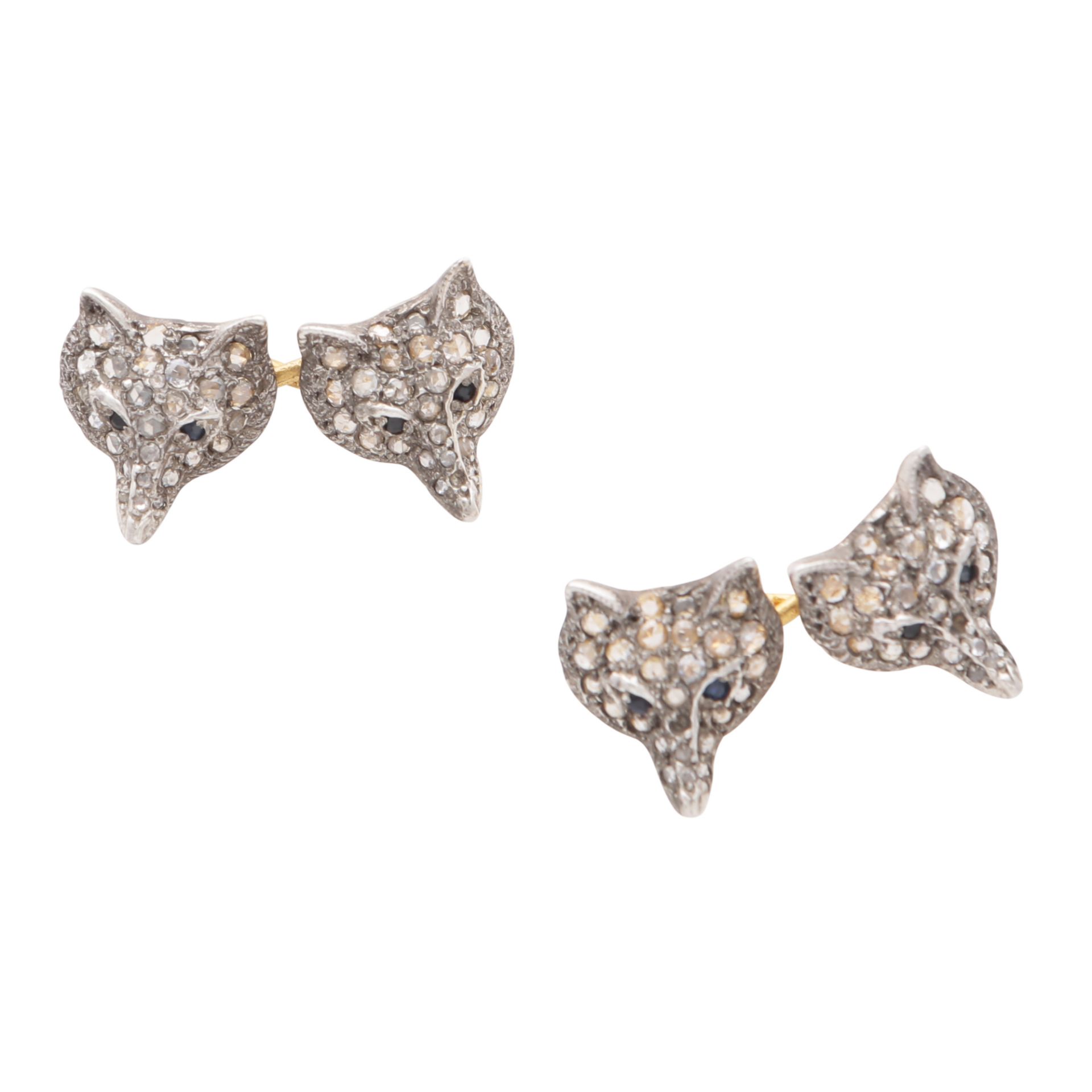 A PAIR OF SAPPHIRE AND DIAMOND FOX CUFFLINKS in silver and gold, each designed as two foxes head