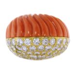 A CORAL AND DIAMOND RING, CARTIER CIRCA 1950 in high carat yellow gold, of bombe design, one side