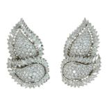 A PAIR OF DIAMOND CLIP EARRINGS in 18ct white gold, each designed a two overlapping leaves