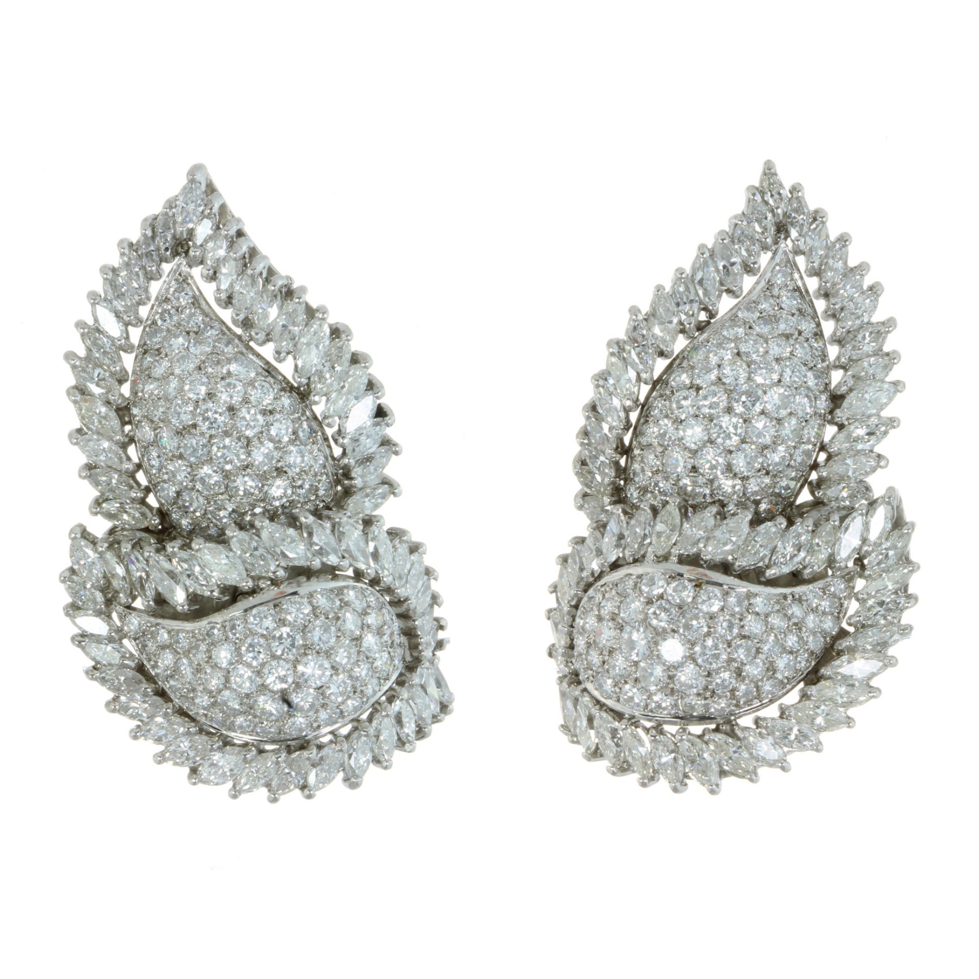 A PAIR OF DIAMOND CLIP EARRINGS in 18ct white gold, each designed a two overlapping leaves