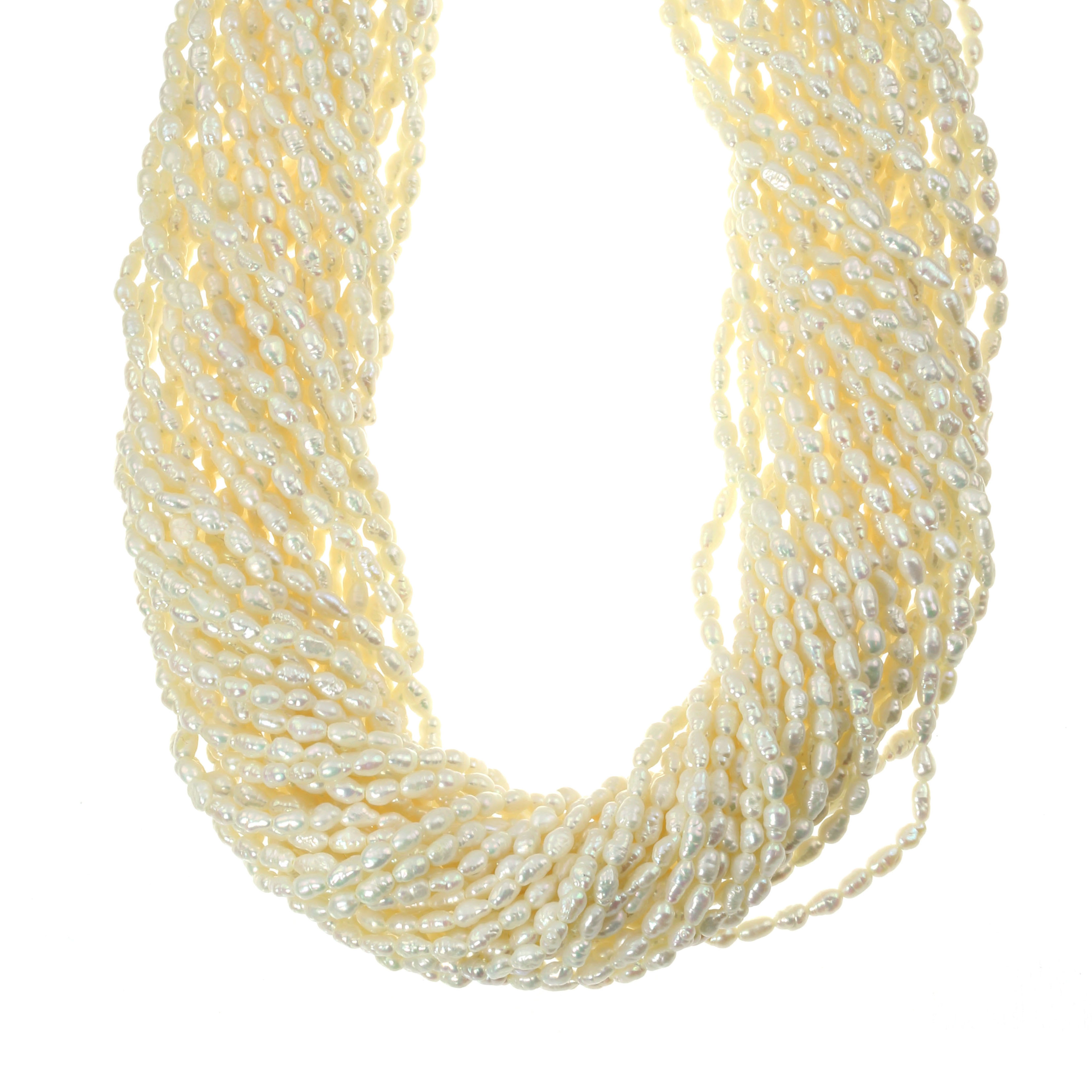 A PEARL TORSAE NECKLACE in 18ct yellow gold, comprising several strands of pearls twisted around