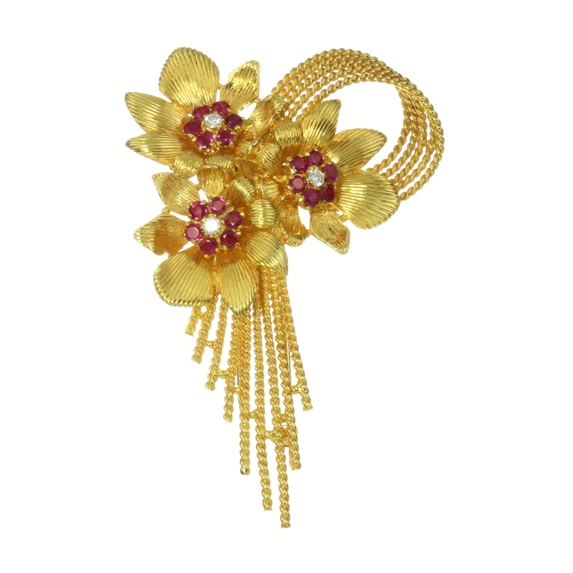 A VINTAGE RUBY AND DIAMOND BROOCH, KUTCHINSKY 1959 in 18ct yellow gold, designed as a trio of