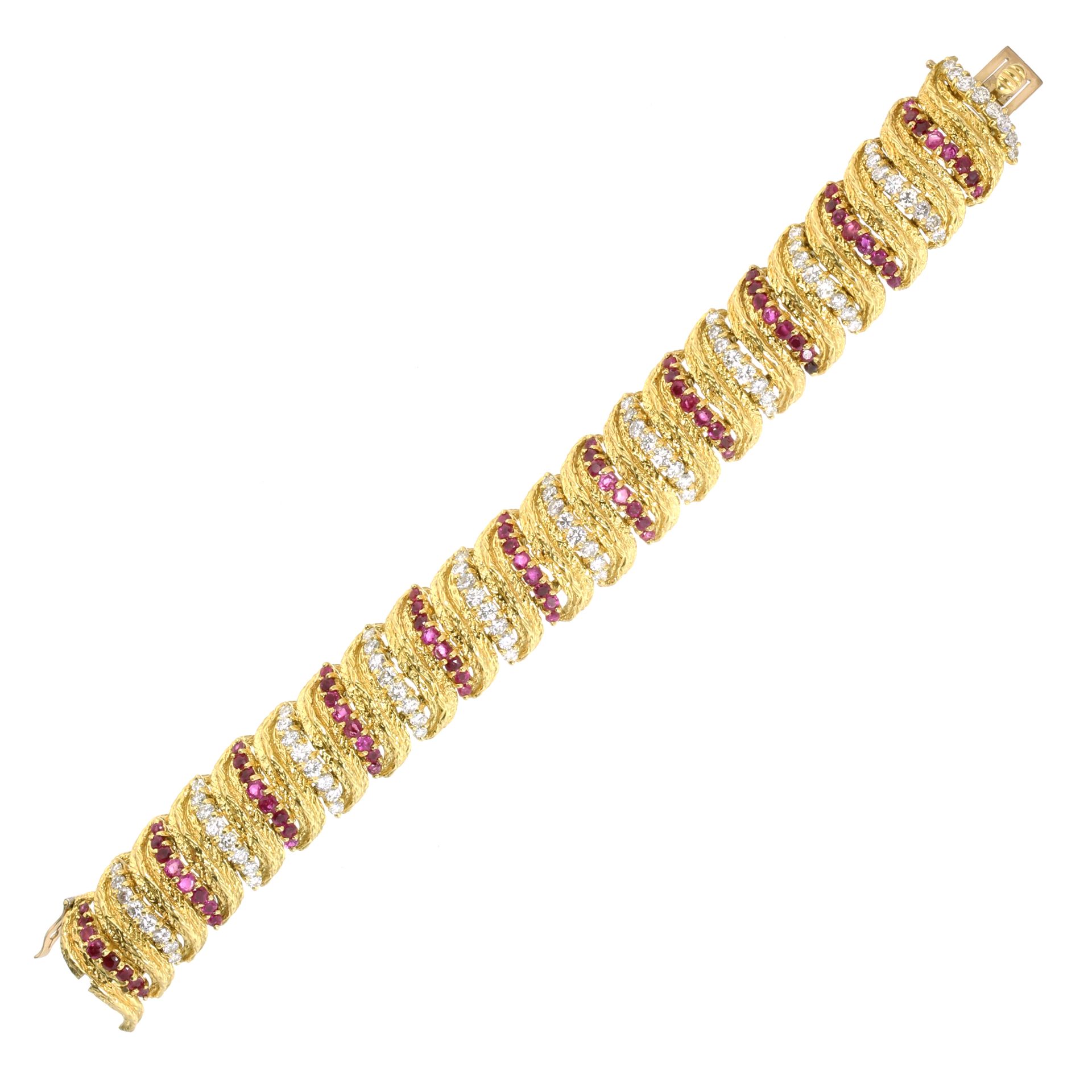 A VINTAGE RUBY AND DIAMOND BRACELET, KUTCHINSKY 1966 in 18ct yellow gold comprising a single row