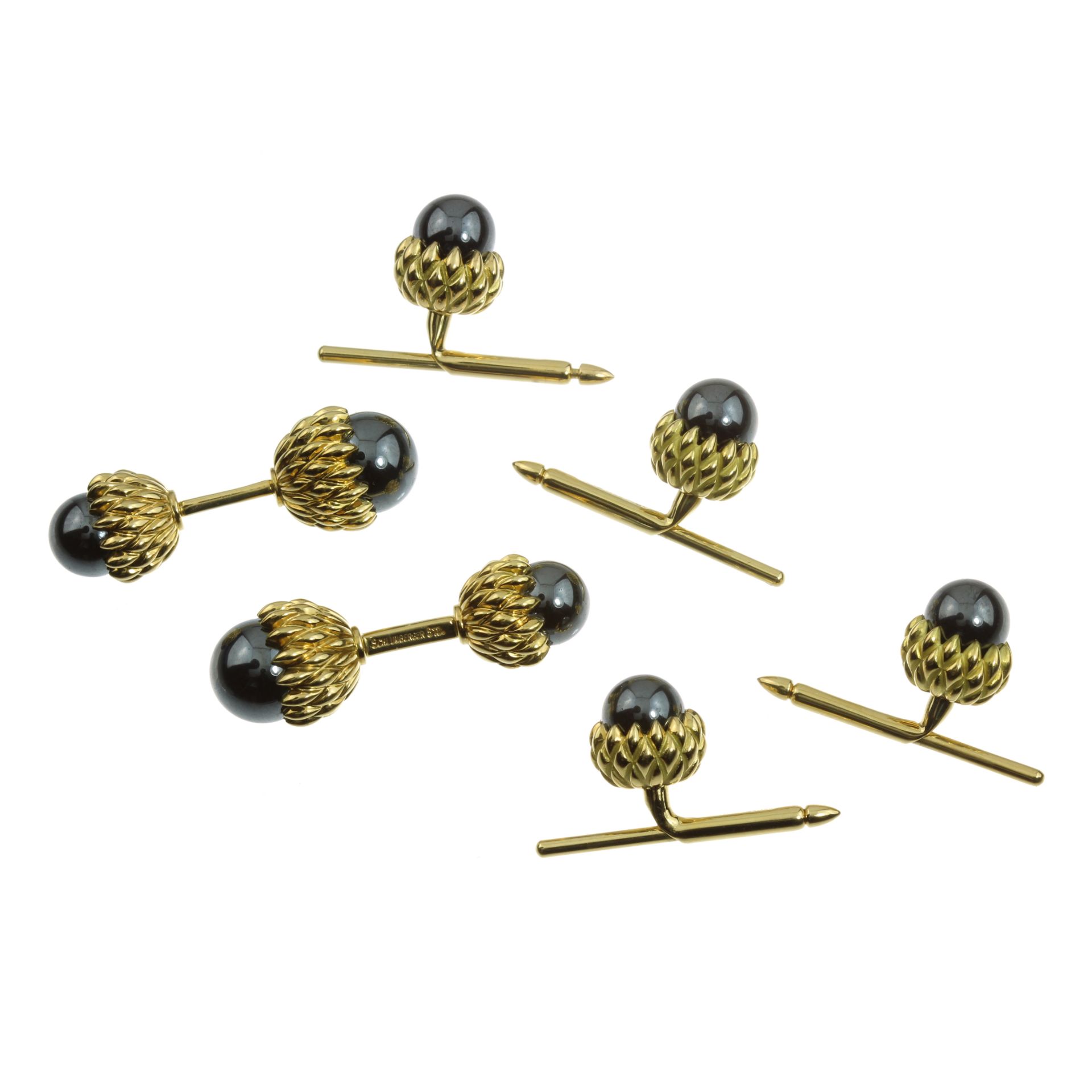 A HEMATITE ACORN CUFFLINKS AND SHIRT STUD DRESS SET, SCHLUMBERGER, TIFFANY & CO in 18ct yellow gold,