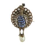 AN ANTIQUE PEARL, DIAMOND, SAPPHIRE AND EMERALD PEACOCK BROOCH / PENDANT in high carat yellow gold