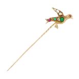 AN ANTIQUE EMERALD, DIAMOND AND RUBY BIRD TIE / STICK PIN in high carat yellow gold, designed as a