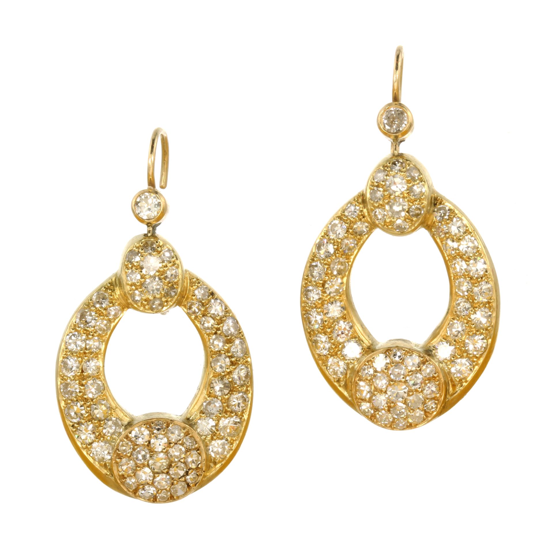 A PAIR OF DIAMOND EARRINGS in high carat yellow gold each comprising two graduated diamond set