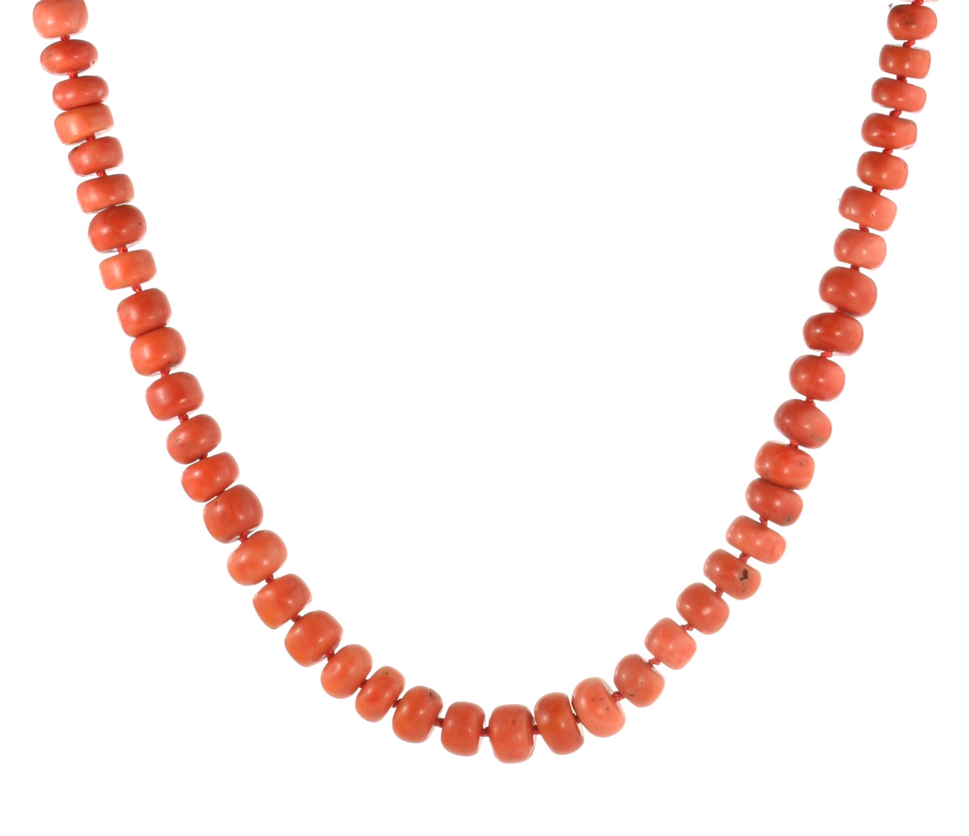 AN ANTIQUE CORAL BEAD NECKLACE comprising a single row of ninety-three polished beads of 11-15mm,