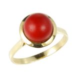 A CORAL BEAD DRESS RING in high carat yellow gold, set with a single coral bead of 8.4mm,