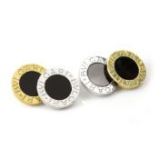 A PAIR OF BLACK ONYX CUFFLINKS BY BVLGARI in 18ct yellow and white gold, each circular face set with