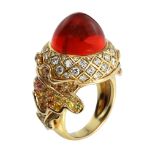 A VINTAGE FIRE OPAL, DIAMOND AND RAINBOW SAPPHIRE RING, MARCHAK in 18ct yellow gold, set with a