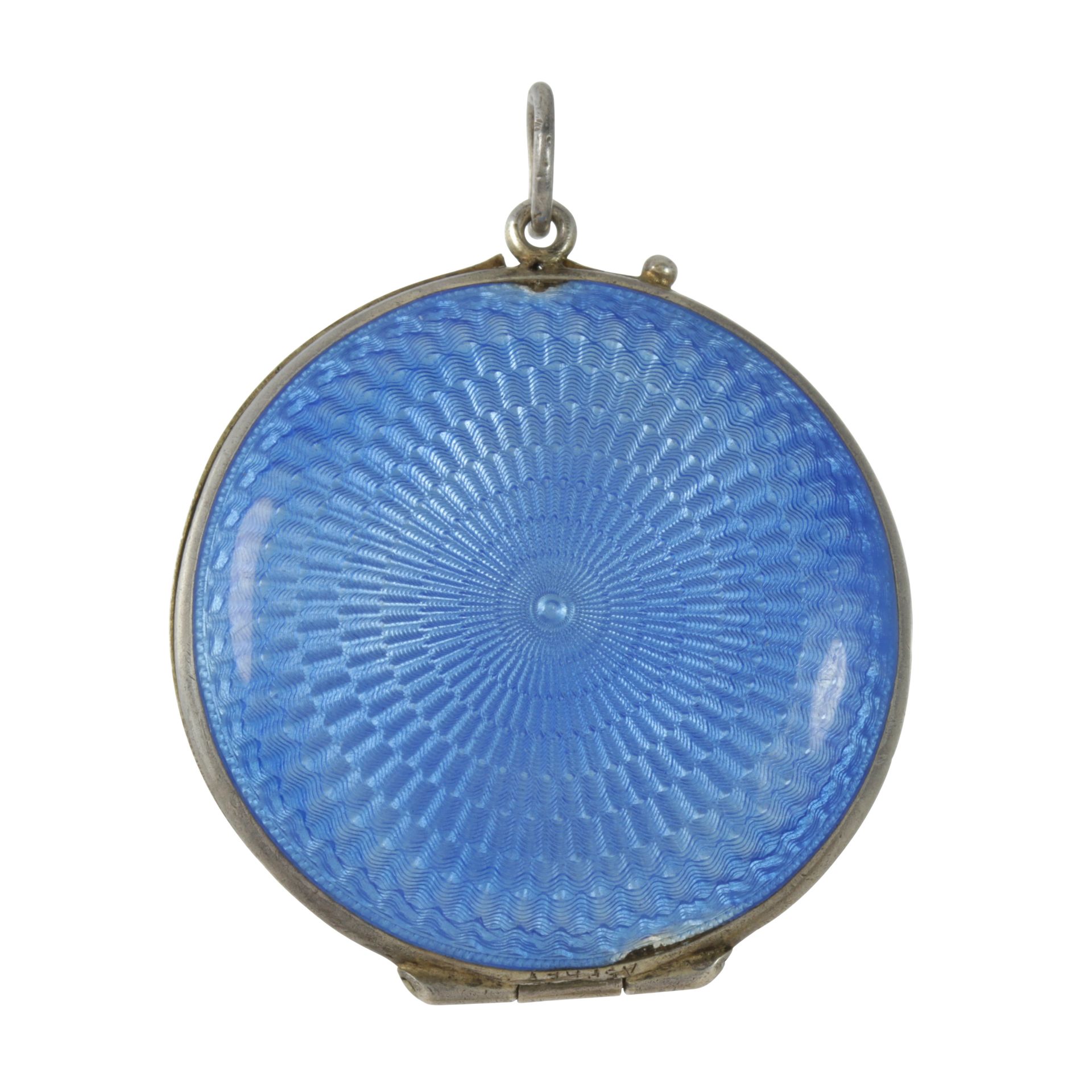 AN ANTIQUE ENAMEL COMPACT / LOCKET, MARIUS HAMMER in silver of circular form, decorated with blue