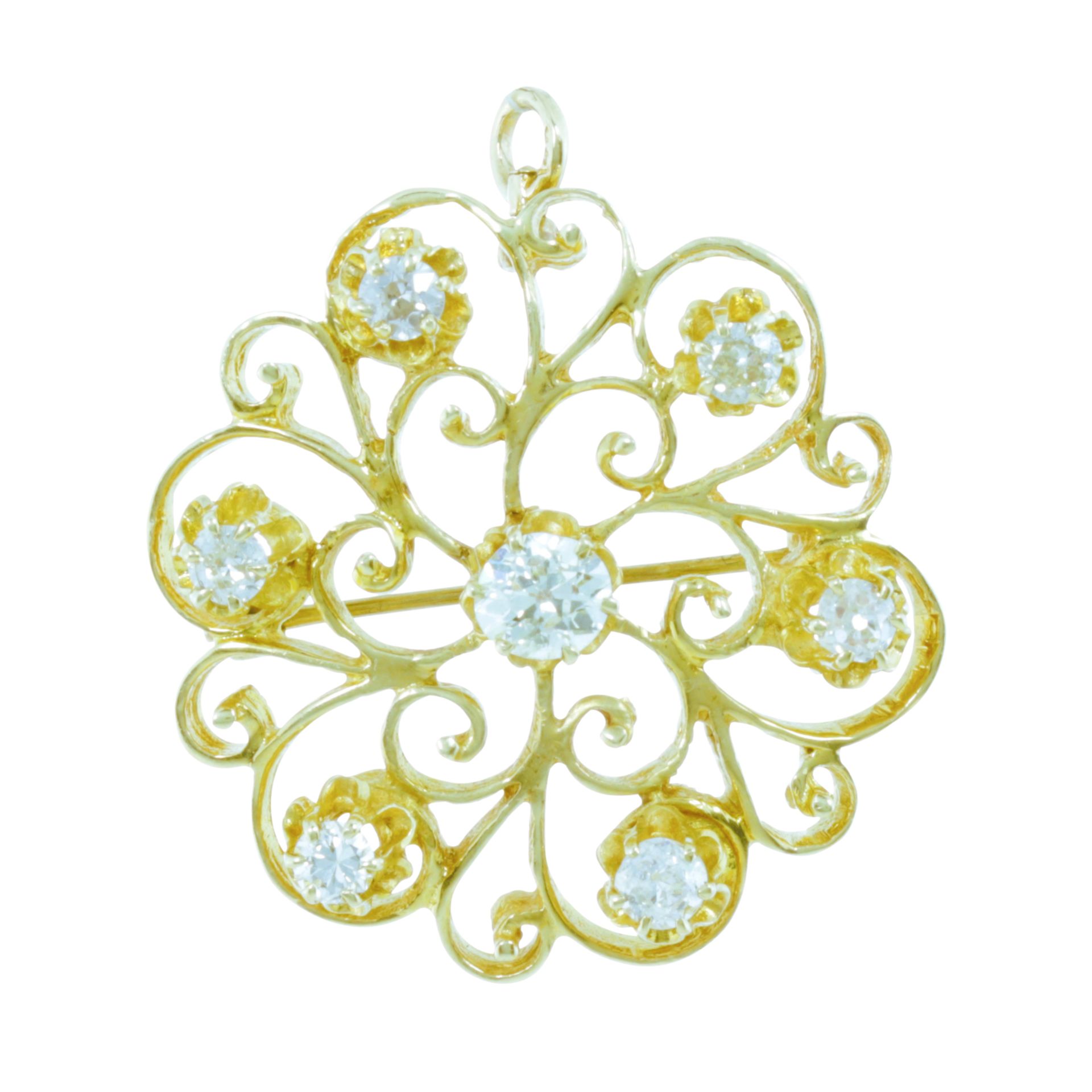 A DIAMOND BROOCH / PENDANT in 14ct yellow gold, set with seven round cut diamonds totalling 1.15