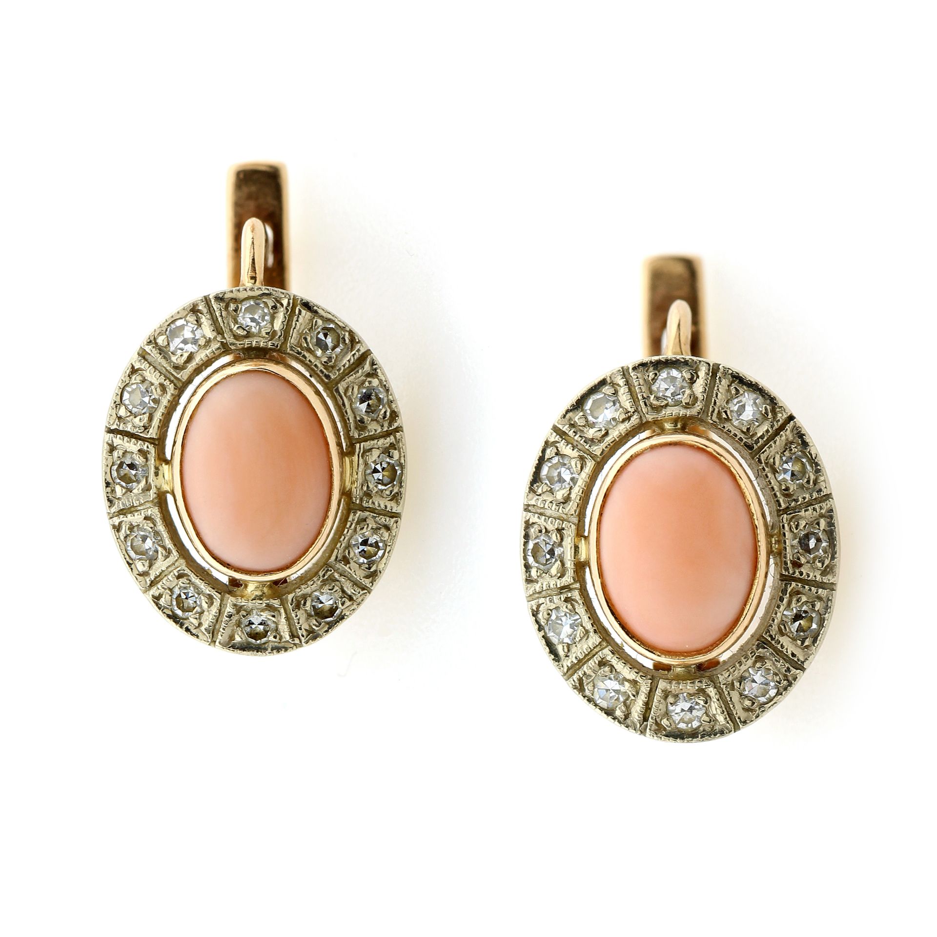 A PAIR OF CORAL AND DIAMOND EARRINGS, CIRCA 1960 in 14ct yellow gold, each set with an oval coral