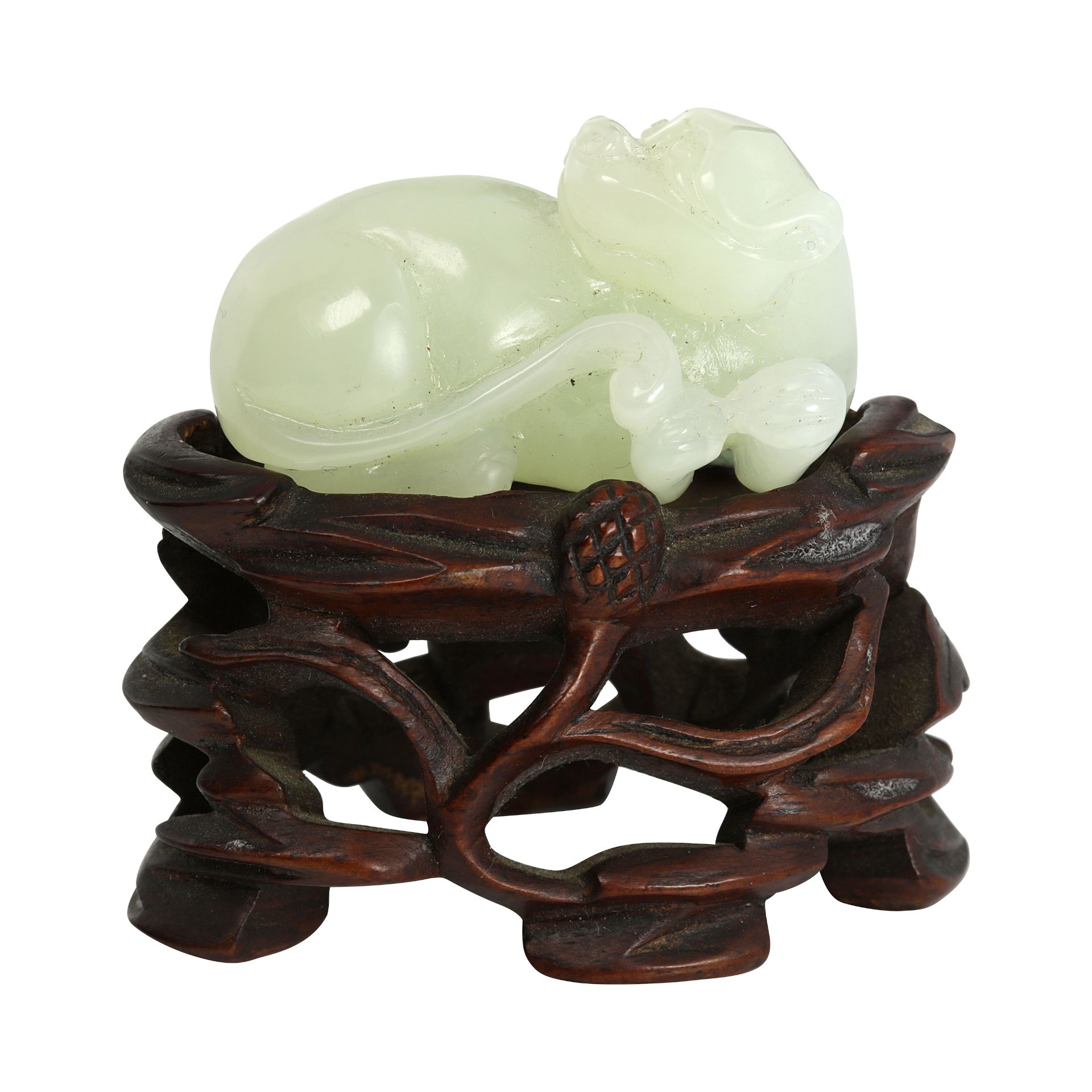 A CHINESE CARVED JADE STATUE OF A LION CUB carved in detail to depict a recumbent lion cub looking