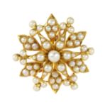 AN ANTIQUE PEARL STAR BROOCH in yellow gold, designed as a star motif, jewelled with pearls,