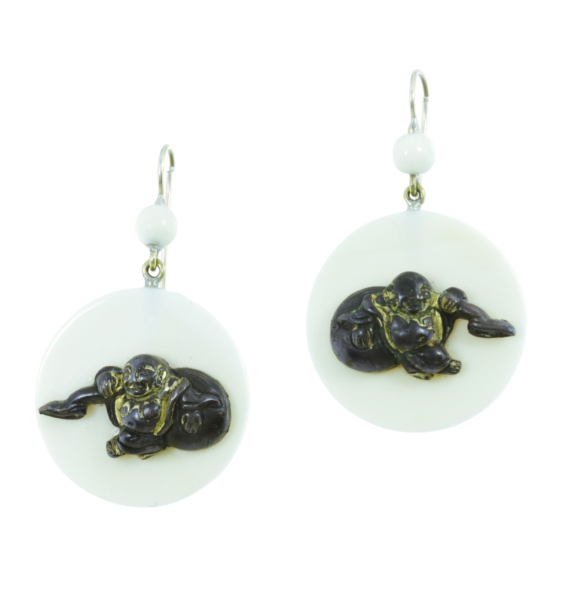 A PAIR OF ANTIQUE CARVED IVORY EARRINGS in yellow gold, the circular ivory bodies with carved