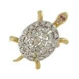 A RUBY AND DIAMOND TURTLE BROOCH in yellow and white gold designed as a turtle, its head and shell