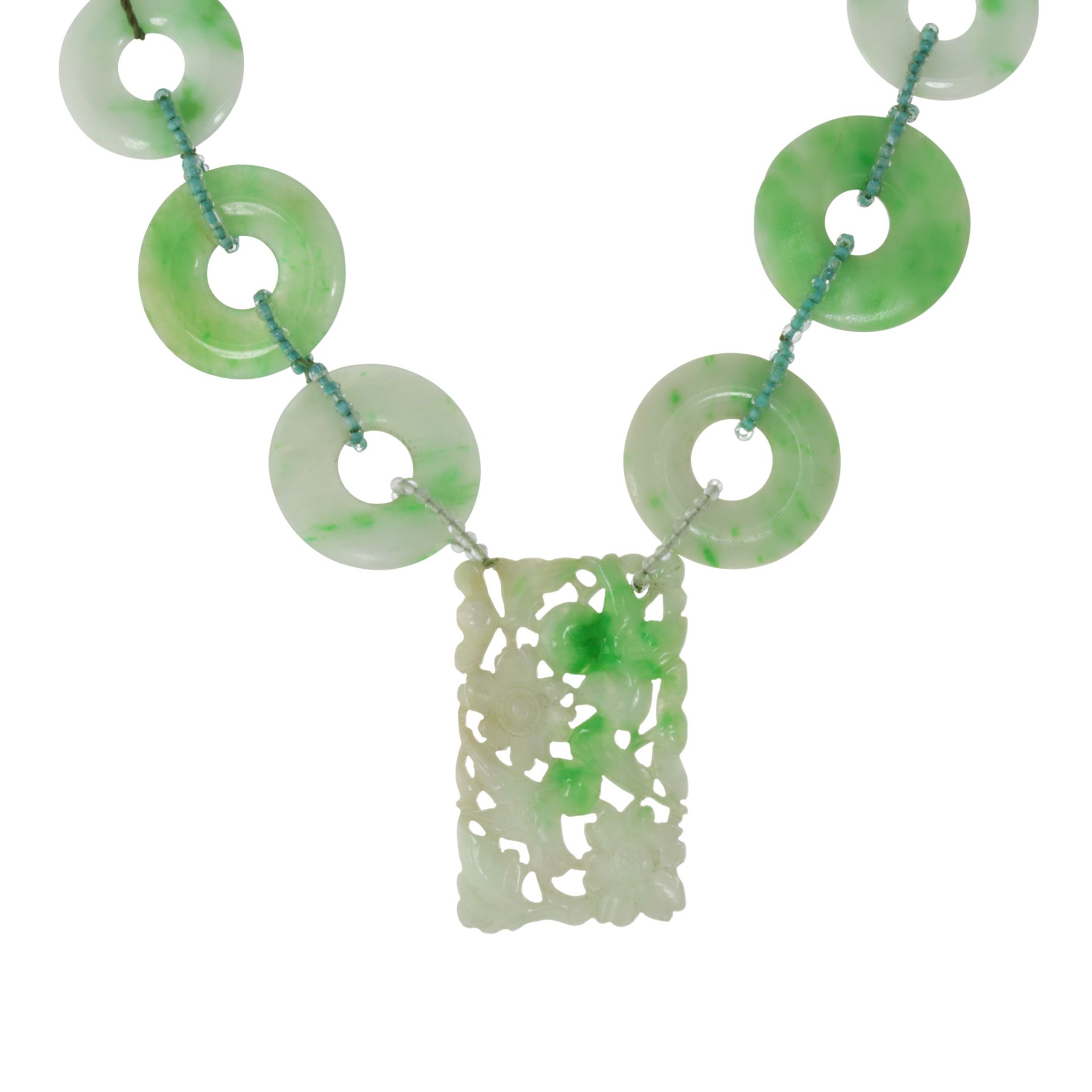 A CHINESE CARVED JADEITE JADE NECKLACE comprising a rectangular piece of jade carved in floral