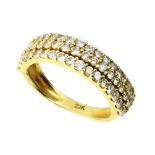 A DIAMOND HALF ETERNITY RING in 22ct yellow gold, set with three rows of round cut diamonds