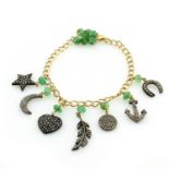 AN EMERALD AND DIAMOND CHARM BRACELET designed as a curb link chain with a cluster of emerald